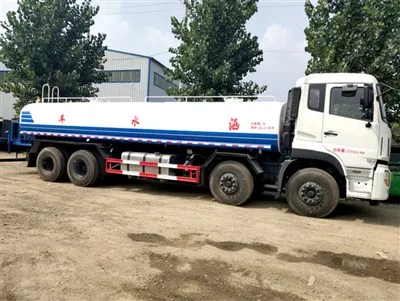 How do sprinkler trucks handle blockages in the spraying pipes?